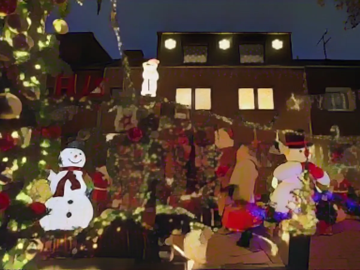 Christmas houses shine with thousands of lights