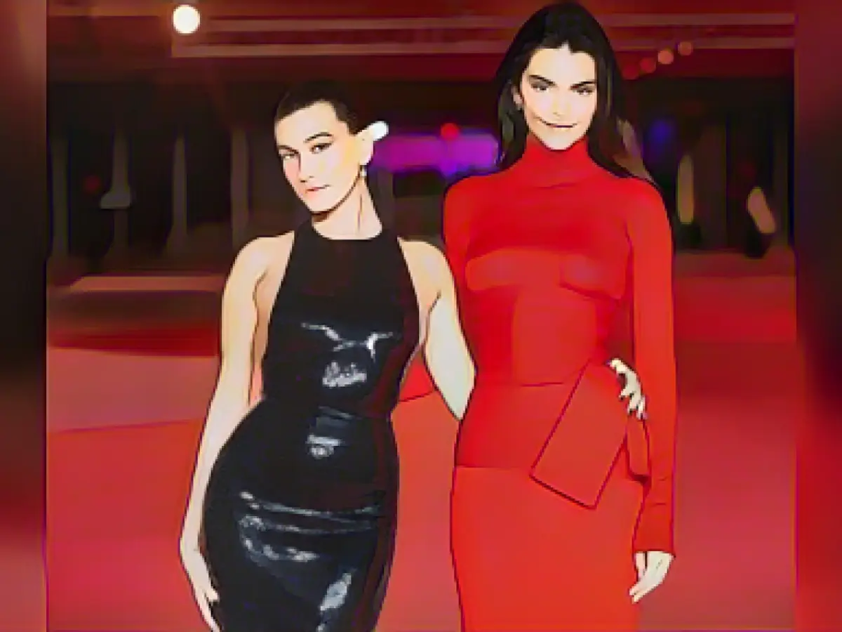 She slips into the see-through dress without a bra