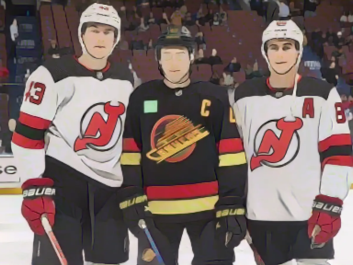 The Hughes brothers had a historic night on the ice as the New Jersey Devils played in the same game for the first time