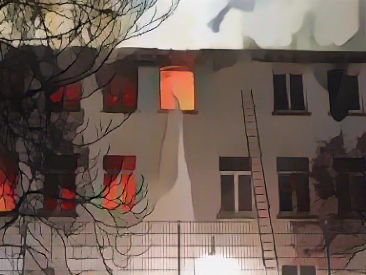 At least one dead in a house fire