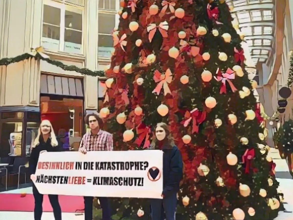 Climate activists smear Christmas trees
