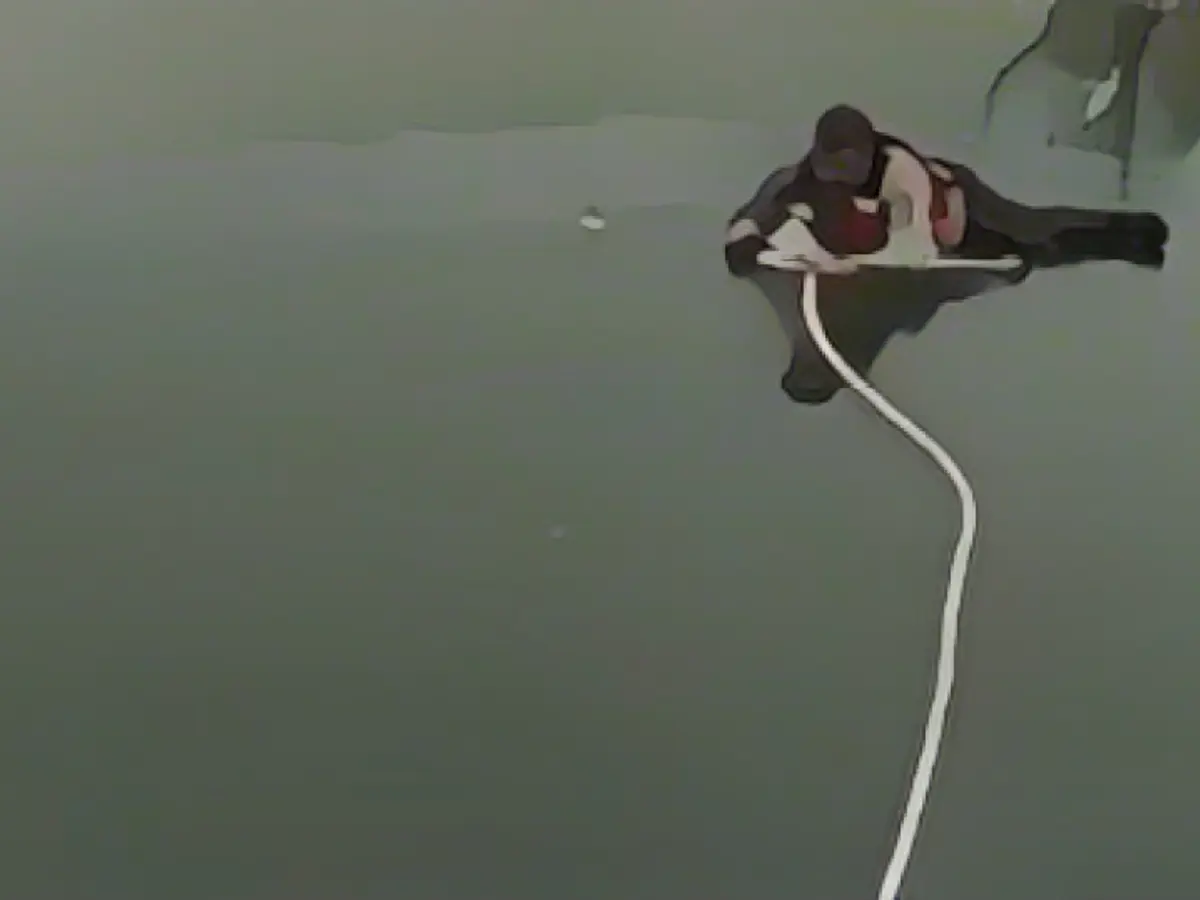 Broke in while ice fishing: Police officers rescue two men and dog from frozen lake