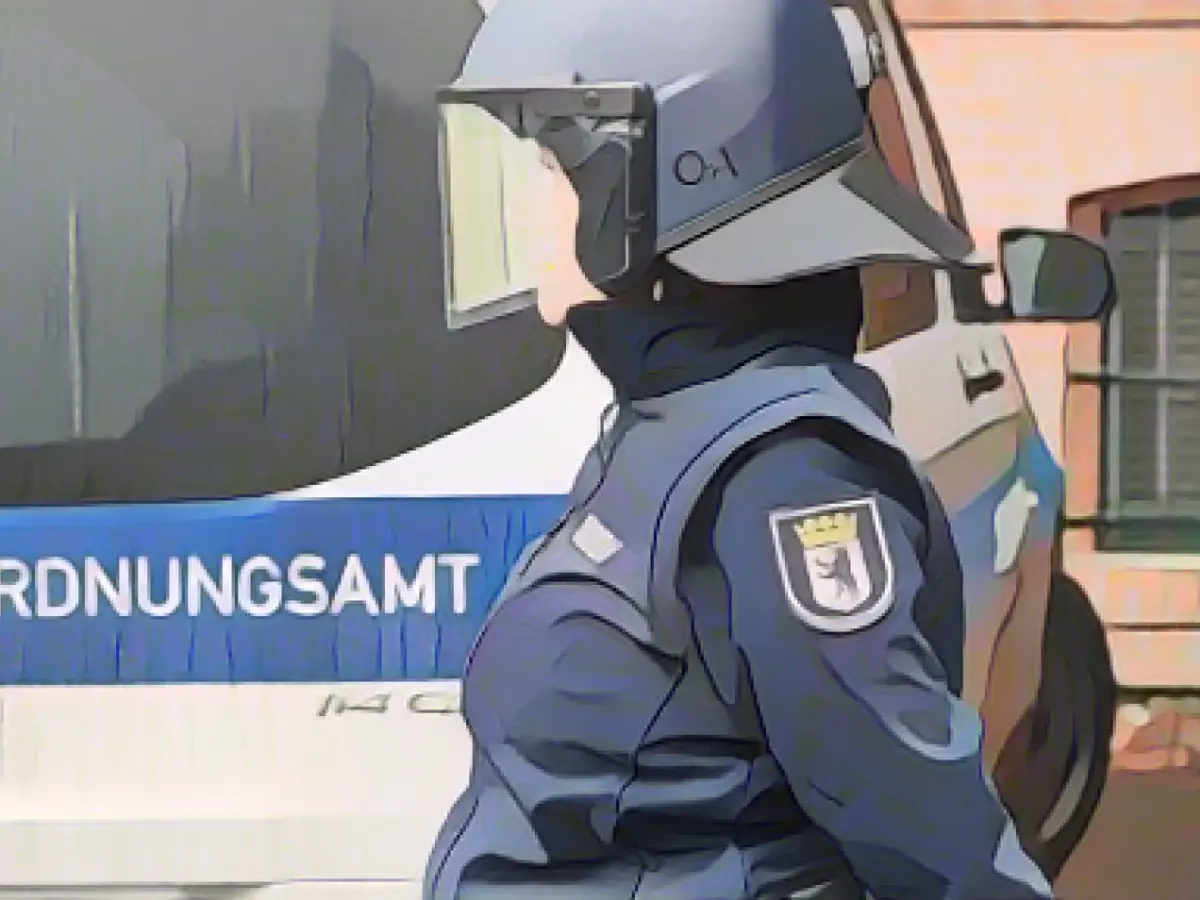 Public order officers equipped with 20 safety helmets