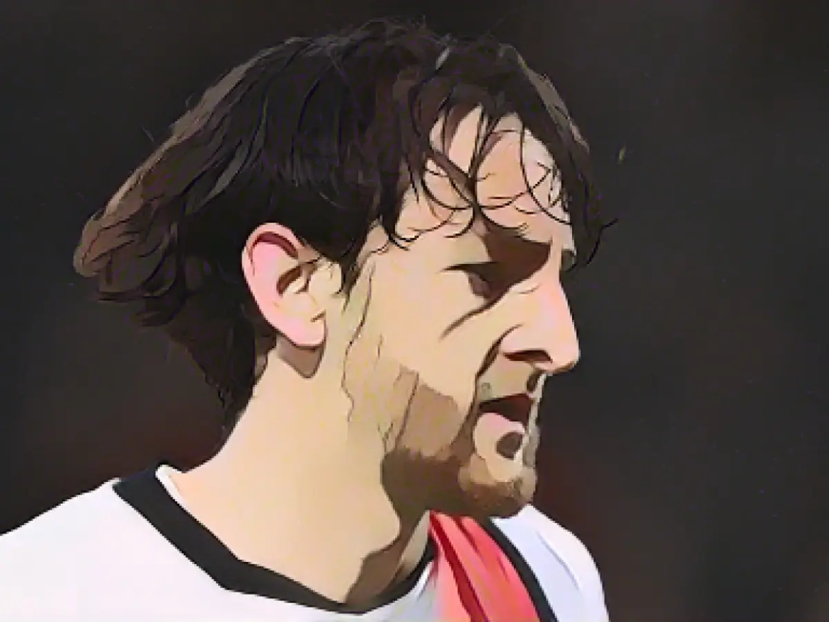 Luton Town player Tom Lockyer reacts after suffering cardiac arrest on the pitch