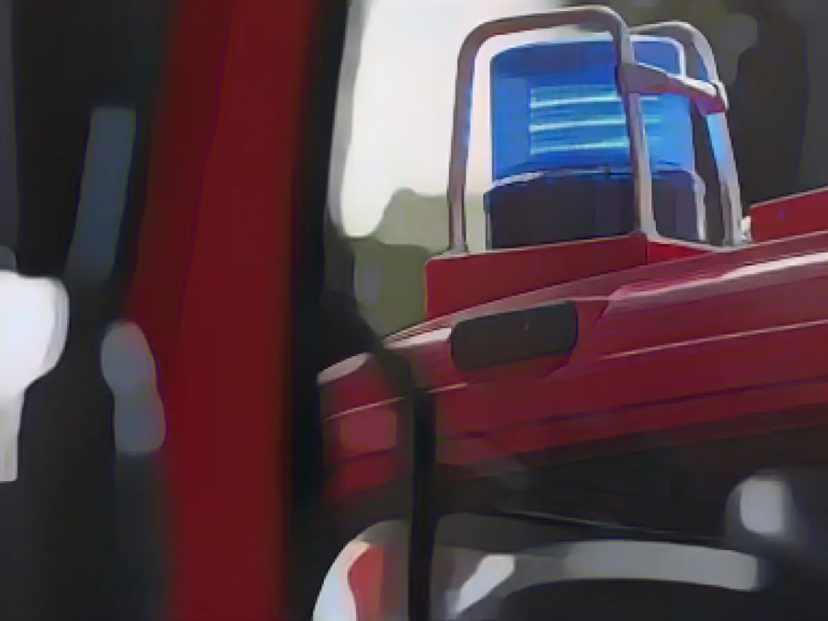 Livestock truck with bulls tips on its side