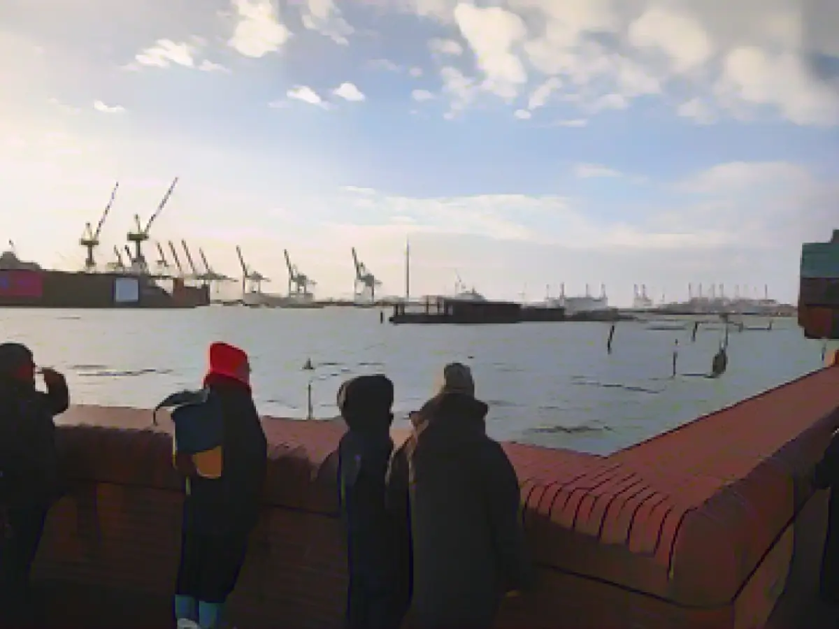 Lots of onlookers at the fish market to watch the storm surge