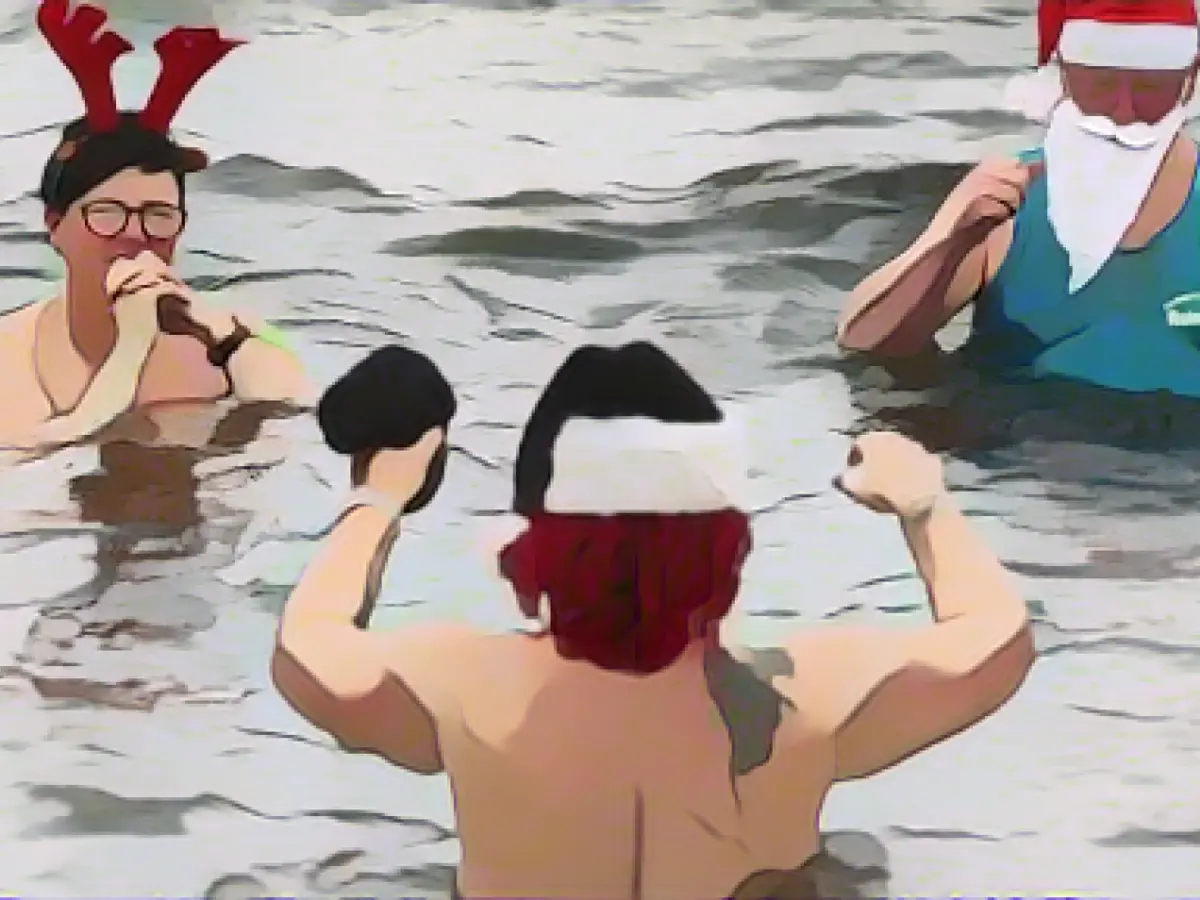 Wearing a pointed cap for a Christmas dip in the lake